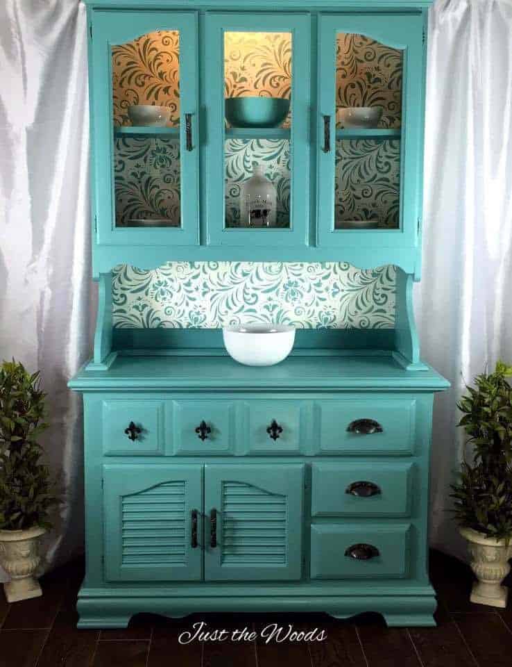 Painted sea foam china cabinet with stencil backing by Just the Woods