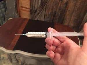 wood glue syringe, repair damaged wood, antique, parlor table