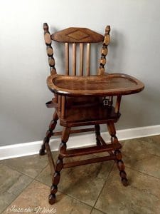 antique wooden high chair with metal tray