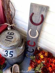 feature weathered wood boards and horse shoes