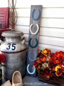 milk can and horse shoes