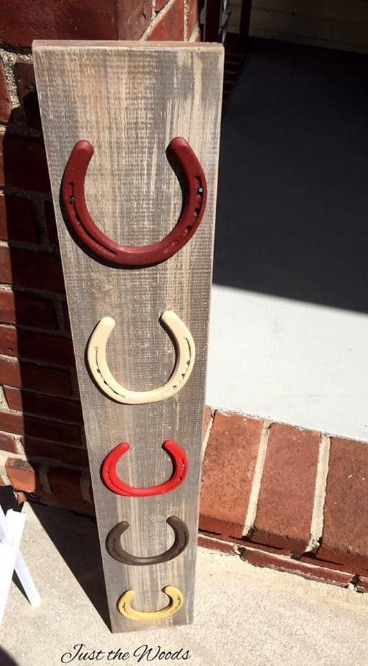 weathered wood and horse shoe display