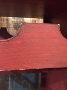 Close up of Distressed Layers, painted kitchen island, wine rack