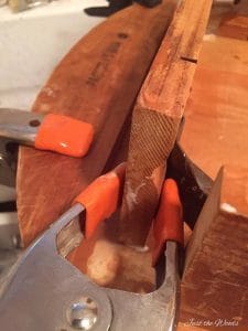 Repair wood furniture with glue and clamps