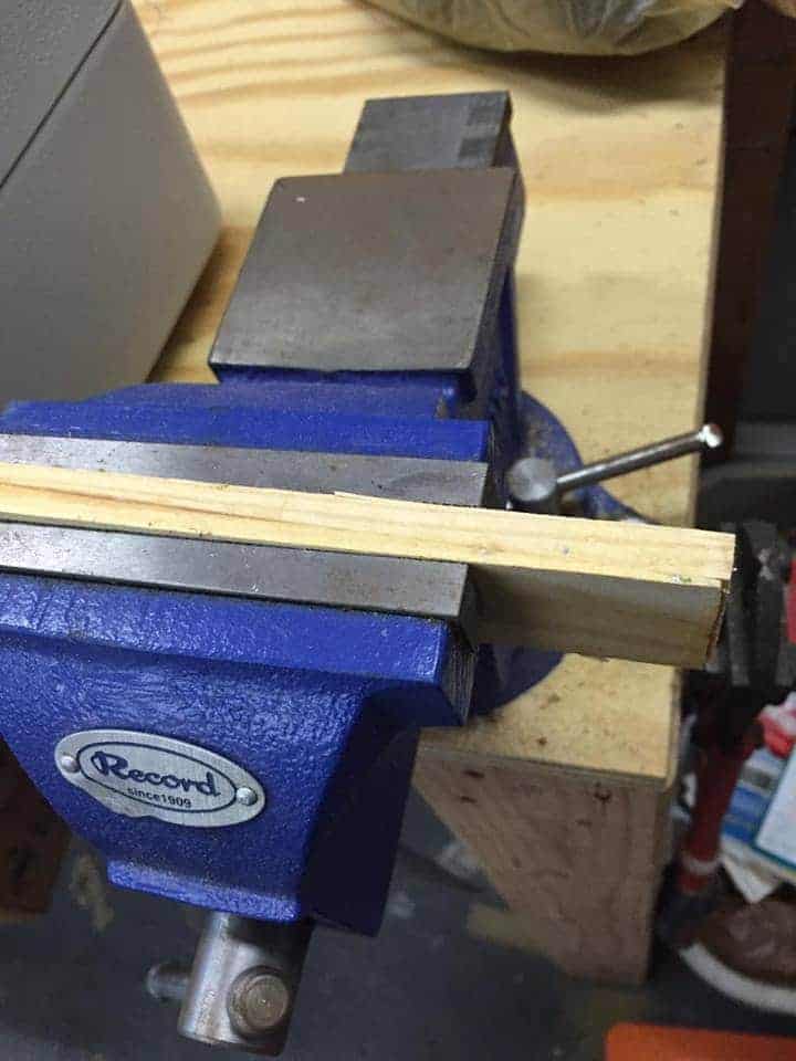 Cut your wood for the drawer stoppers using a vice to hold it.