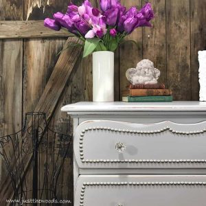 silver-studs-trim-on-dresser-drawers, faus flowers, staging props, home decor