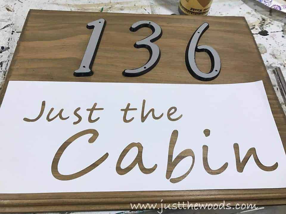 See how to make a custom address sign with scrap wood, a DIY stencil, and stain. Use pre-made house numbers or stencil them yourself with this easy DIY project and Cricut. Rustic address plaque, home sign, number sign, house number sign. 