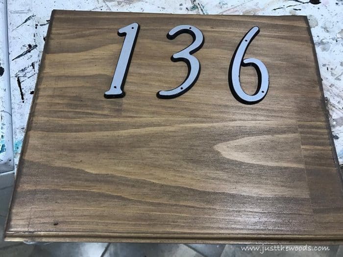 reflective numbers, custom address sign with scrap wood, a DIY stencil, and stain. Use pre-made house numbers or stencil them yourself with this easy DIY project and Cricut. Rustic address plaque, home sign, number sign, house number sign. 