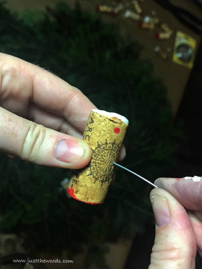 pushing wire through corks, creative cork ideas, wine cork diy