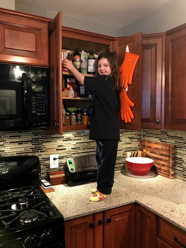 clean kitchen, clean countertops, kid standing on kitchen counter