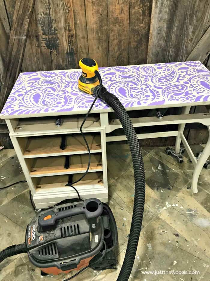 cutting edge stencils, paisley wall stencil, stencil on painted desk, sanding indoors, sander and shop vac