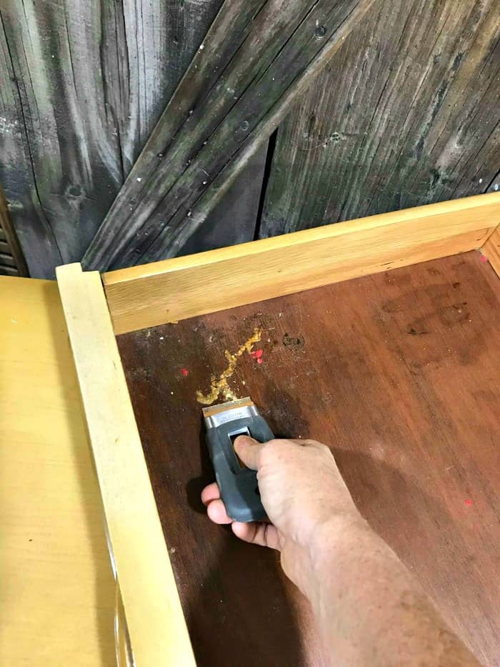 clean old wooden drawers, scrape out dirt, lemon verbena to preserve wood drawers