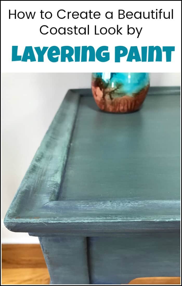Layering paint on your painted furniture project to create a coastal look. This blue painted table is finished in painted layers with an added pop of color. See how to layer paint when painting furniture. This blended and layered painted table has a soft blue coastal vibe. #paintinglayers #howtopaintfurniture #layerpaint #blendingpaint #layeringpaint #layerpaint #paintedfurniture #bluepaintedfurniture #paintedtable #coastalfurniture