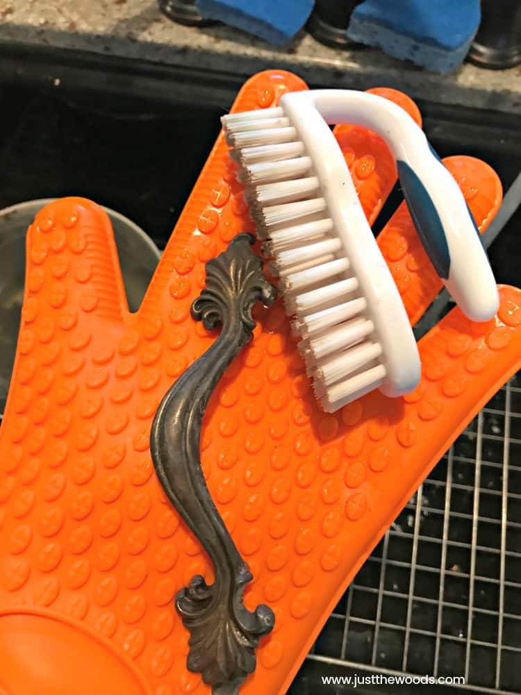 glove and scrub brush to clean old hardware