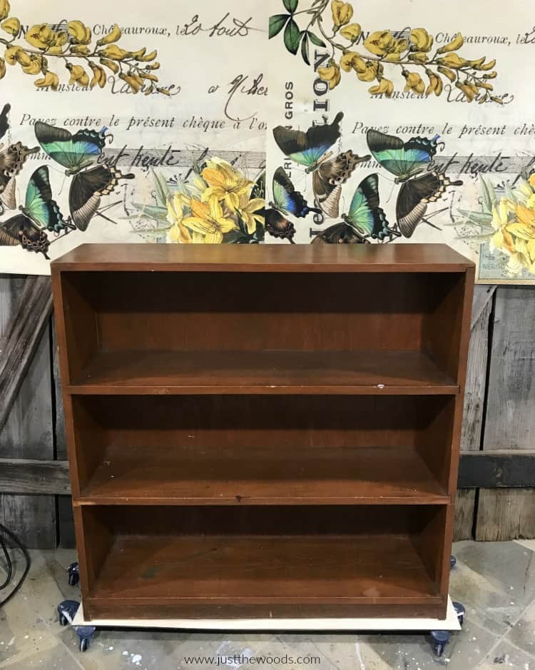 brown wood bookcase, butterfly decoupage paper