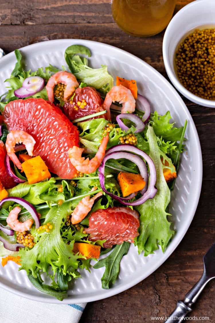 colorful healthy salad, salad with grapefruit, shrimp, arugula, squash