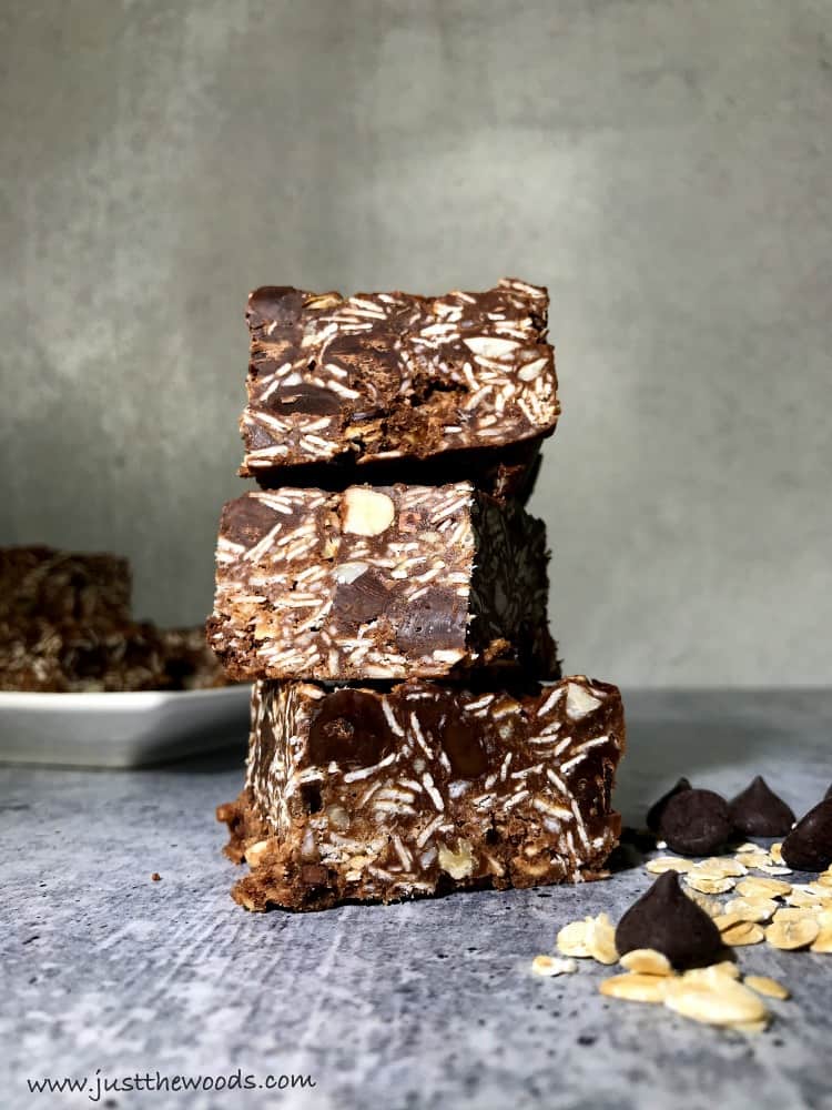 chocolate oat bars with nuts and peanut butter, gluten free, gray backround, no bake chocolate oat bars