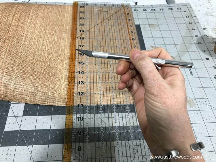 cutting mat, plastic ruler and exacto knife, sharp blade