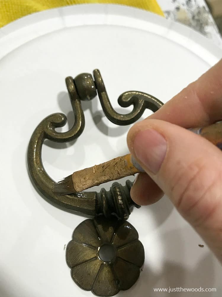 painting metallic bronze paint on hardware with small brush