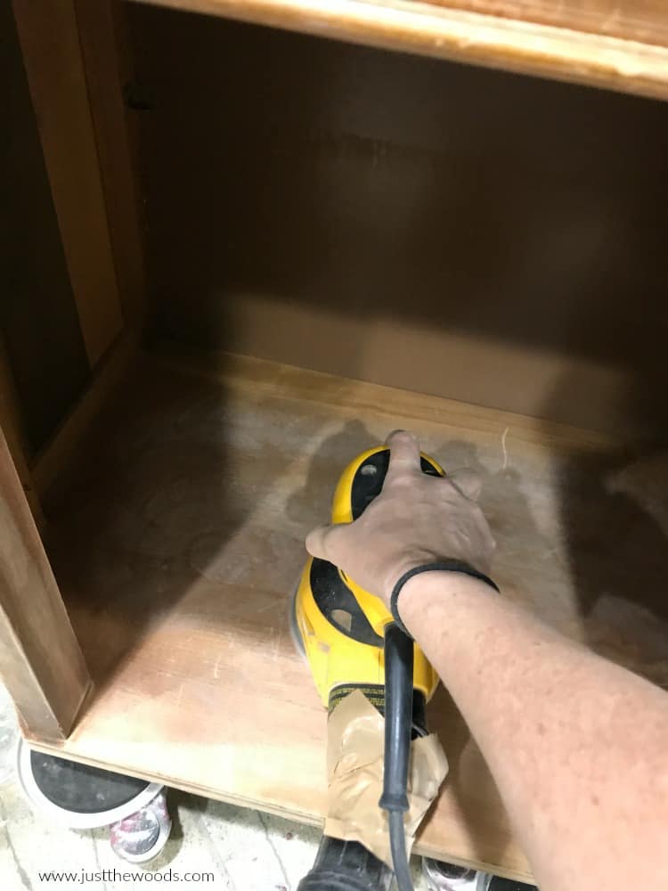 sand inside wooden cabinet