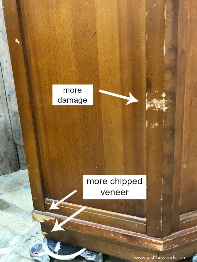 damaged wood and chipped veneer on vintage wood cabinet