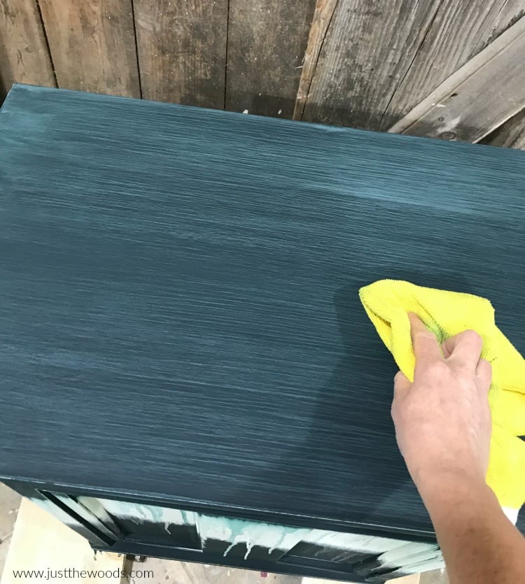 wipe sanding dust with yellow lint free cloth