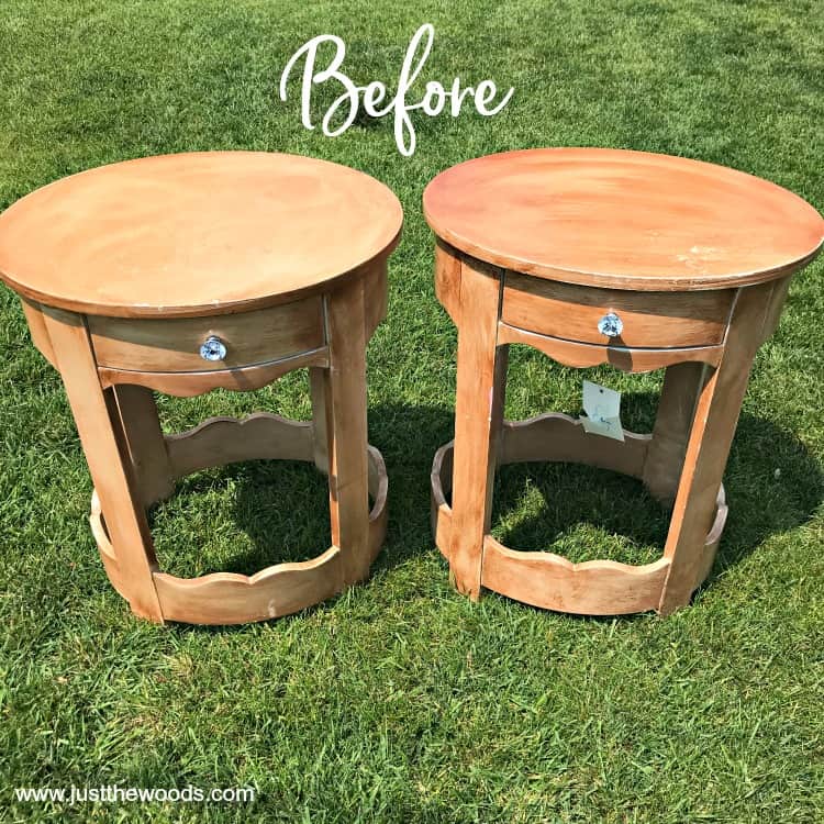 two wooden round tables on the grass before paint