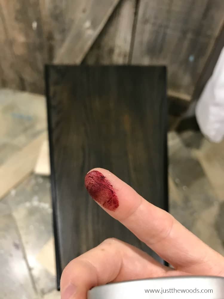 red wax on finger for painted furniture