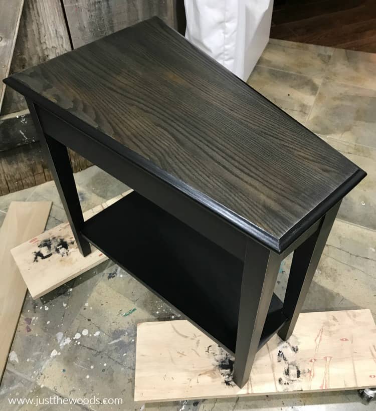 black painted table with black wood stain