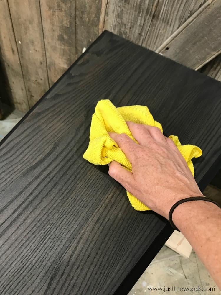 yellow cloth on black wood stain table