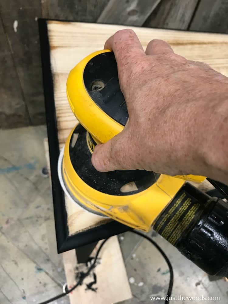 electric sander on wood to remove paint