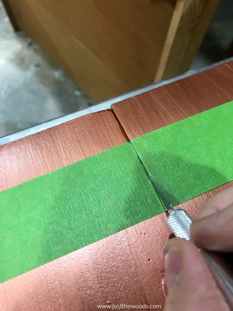 cut painters tape with blade