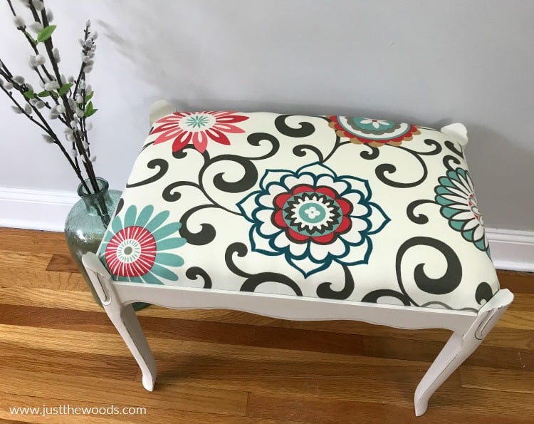 decorative fabric reupholstery on white painted bench