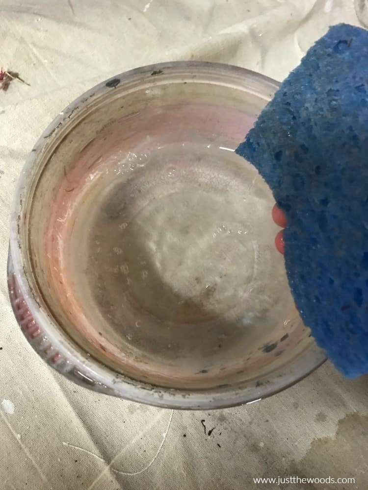 clean water to clean furniture with blue sponge