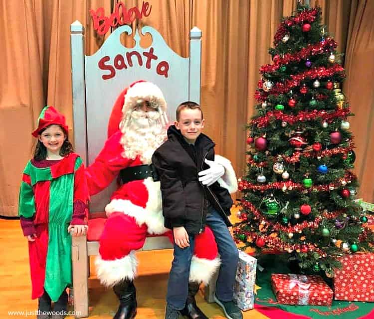 ugly santa chair with cute kids and christmas tree