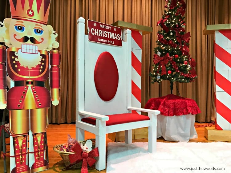 painted upholstered fabric santa chair, cardboard nutcracker statue, santa chair photos