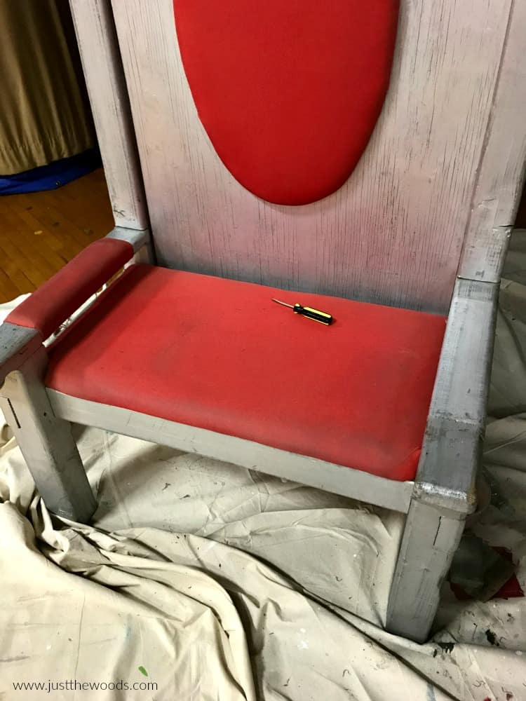 silver painted chair with red fabric