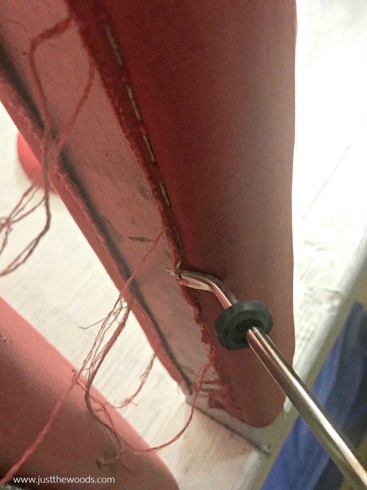 removing upholstery staples with tack lifter