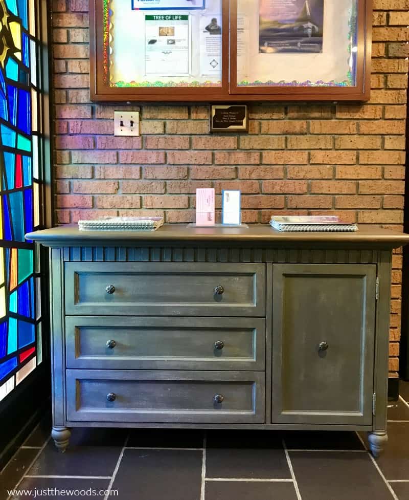 painted dresser donated to church, painted dresser next to stain glass window