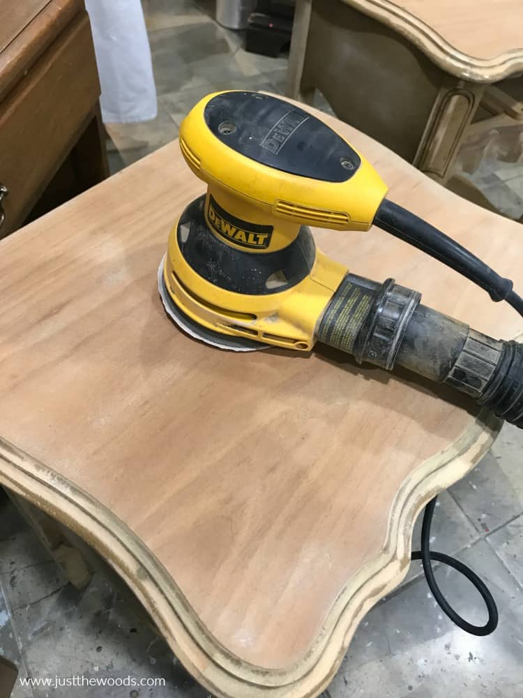 yellow electric Dewalt sander on wood table