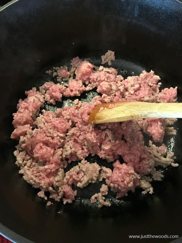 pork sausage lentil soup in cast iron