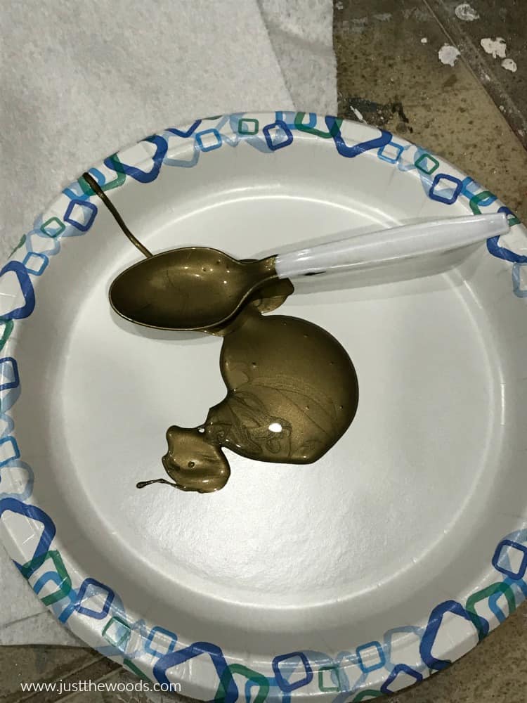  bronze metallic paint on paper plate with plastic spoon