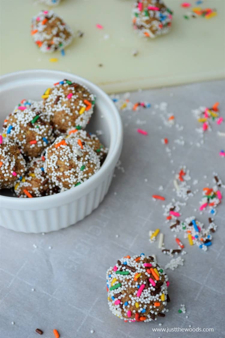 birthday cake cookie dough balls in bowl and on paper