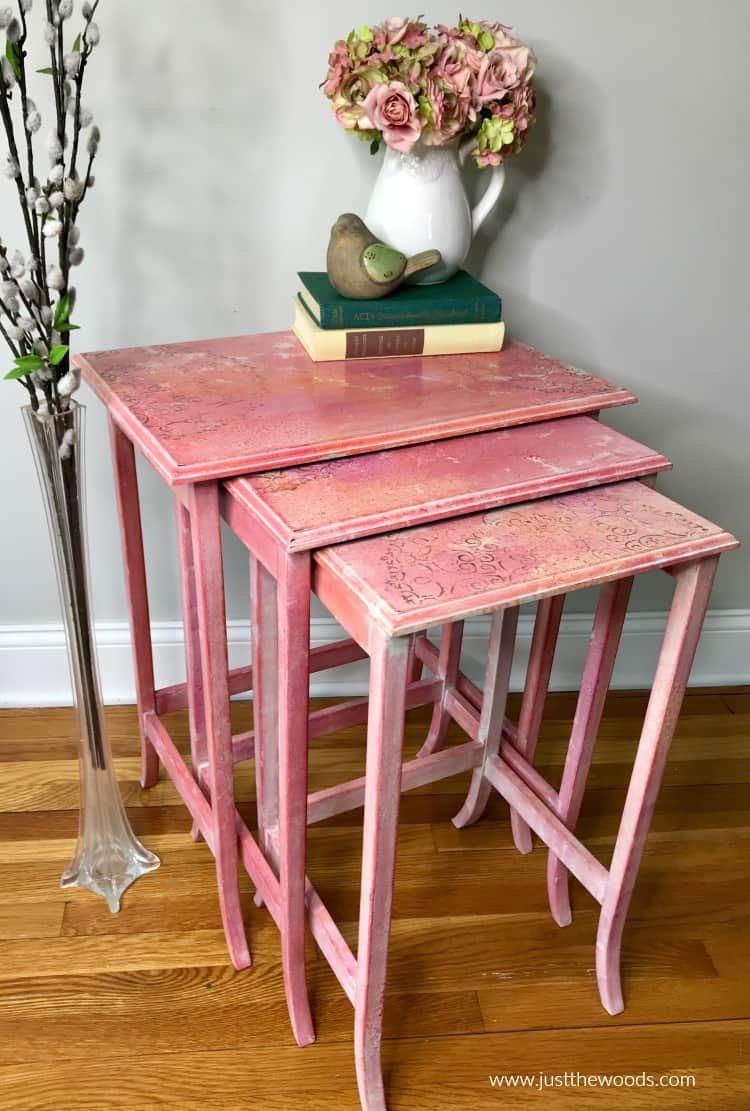 nesting tables makeover with tables pulled out, books and floral vase on top of tables