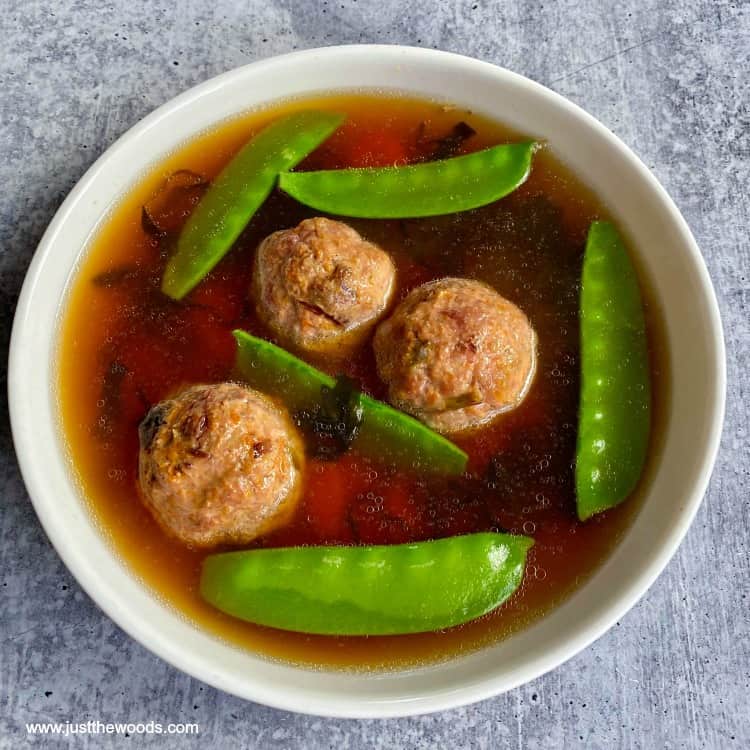 beef bone soup with meatballs and vegetables