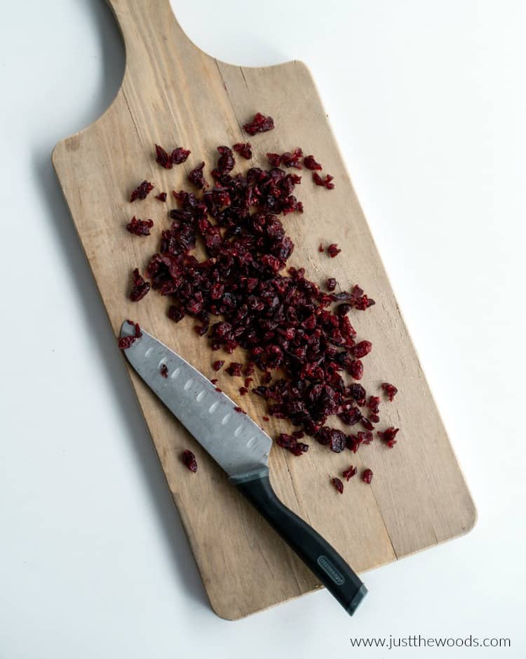 chopped cranberries on wood board