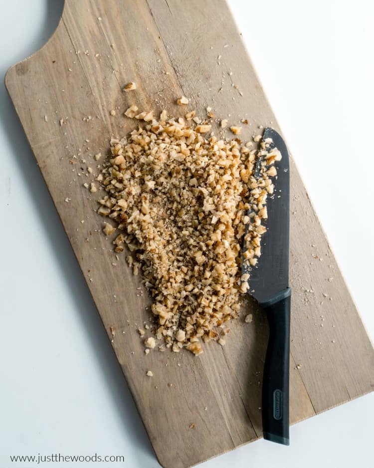 chopped walnuts on wood board