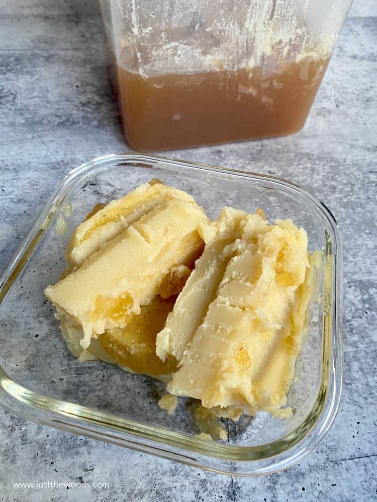 beef fat from bone broth in glass container