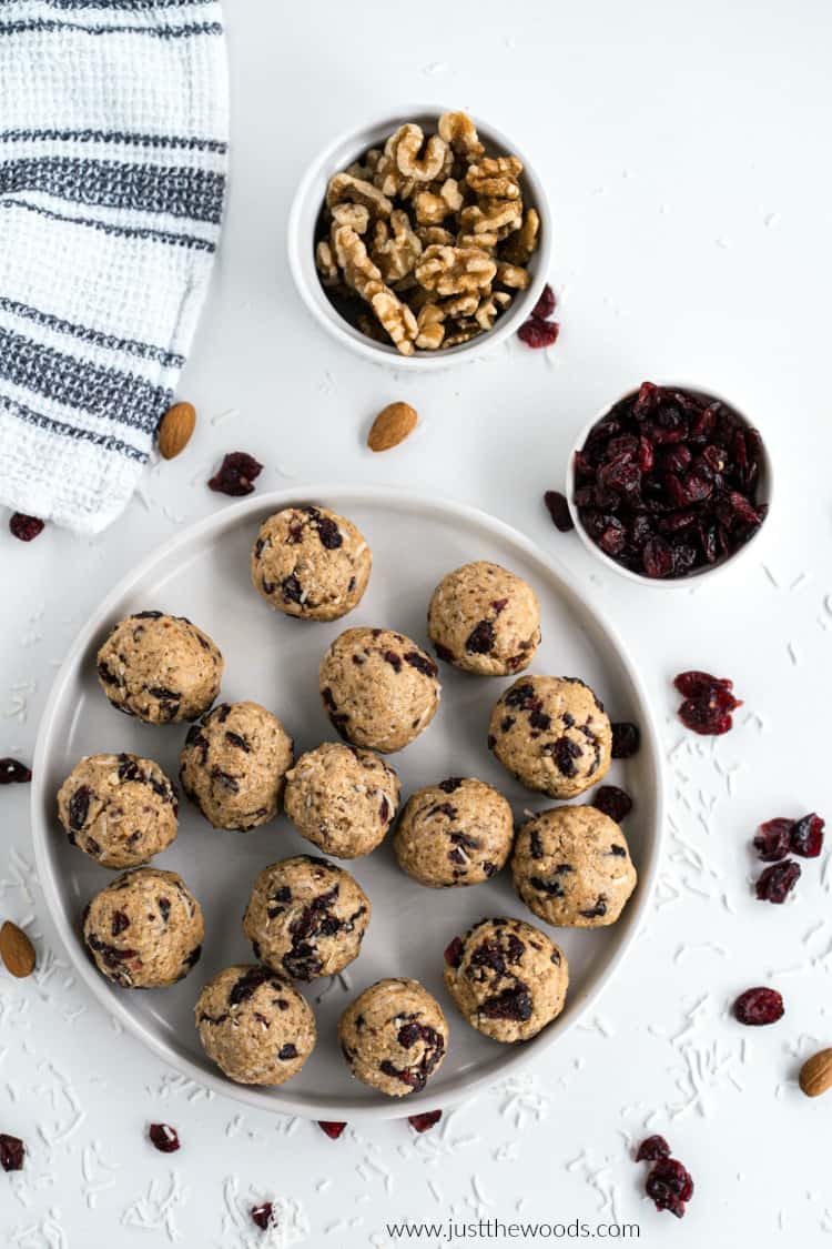 protein energy balls on plate with walnuts and cranberries