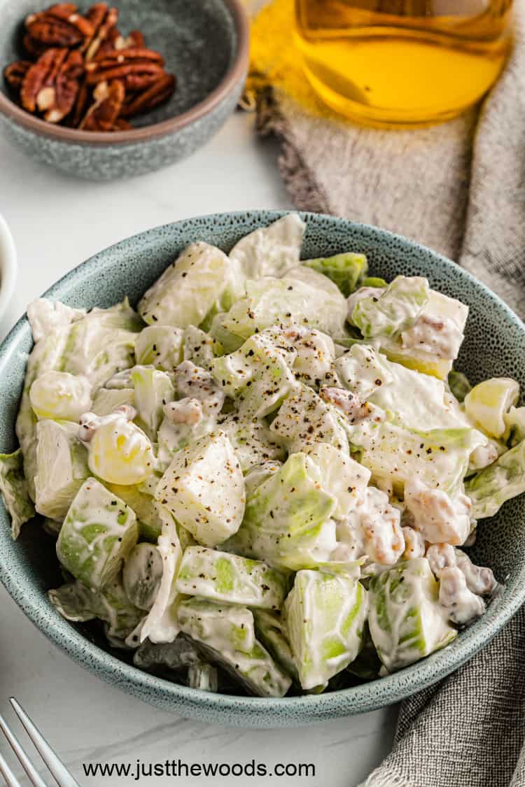 healthy Waldorf salad with apples and grapes in bowl